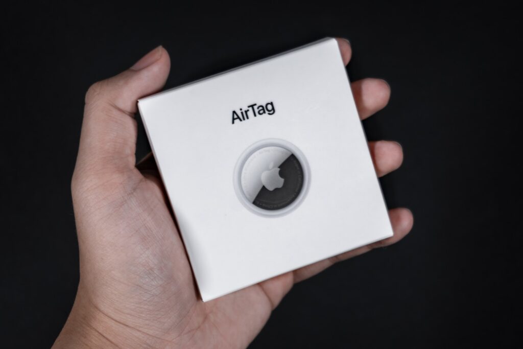 white and black box on persons hand