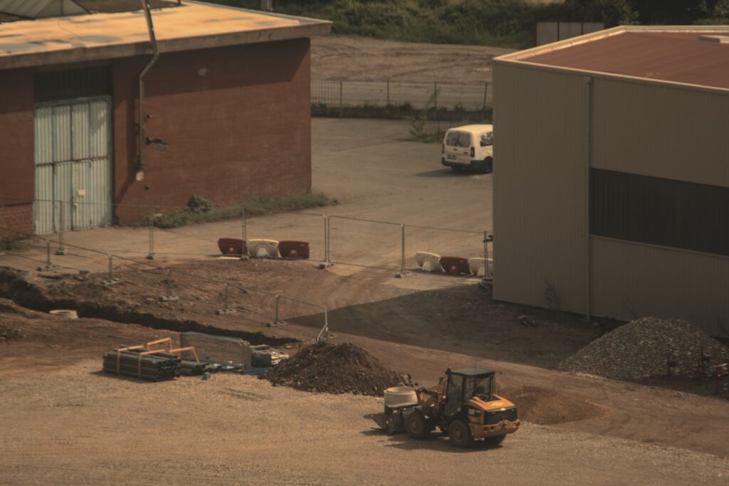 a bulldozer is parked in front of a building