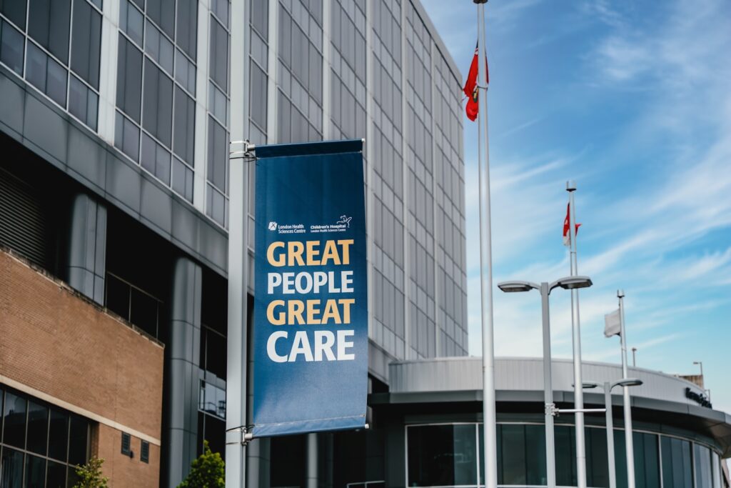 Modern building with a banner reading "great people great care"