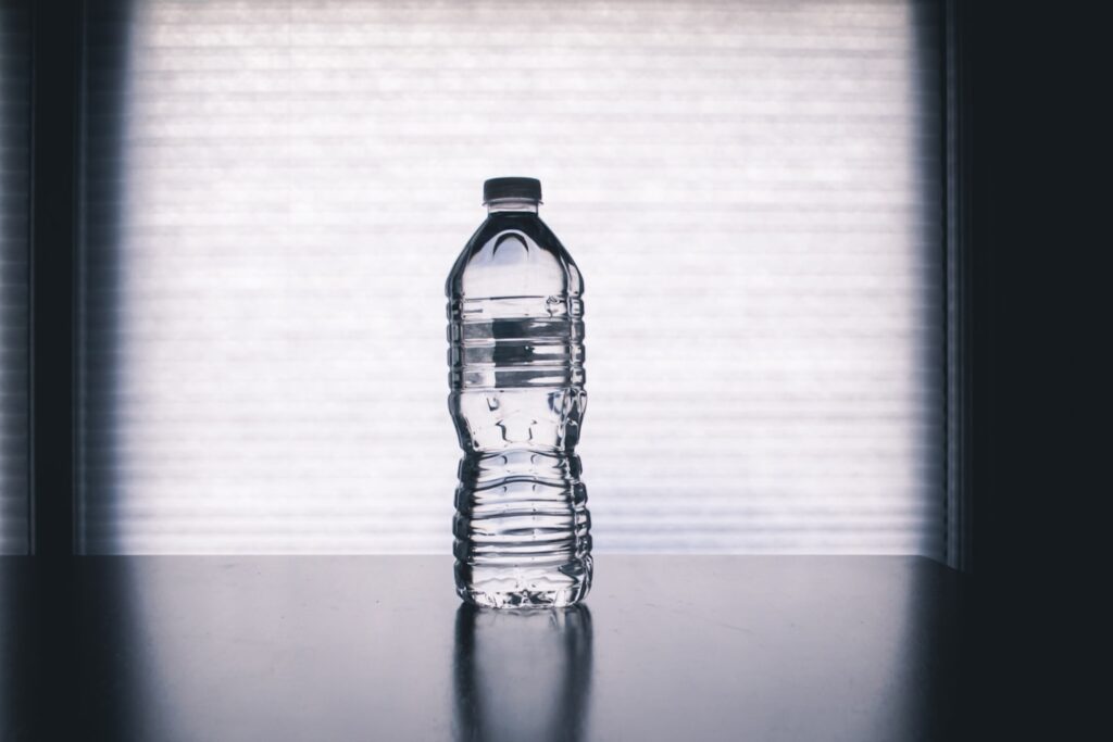clear drinking bottle filled with water