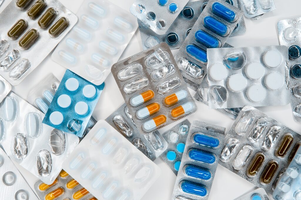 pharmaceuticals in packages of different colors, antibiotics medicine tablets, colorful antibacterial tablets lie, fighting the virus.