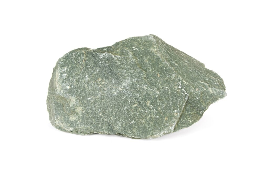 a green rock on a white background